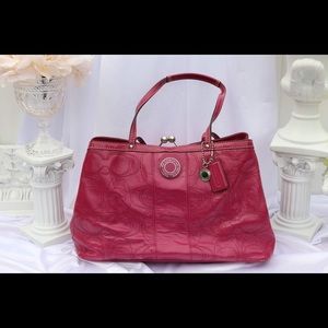 Bright pink Coach handbag
